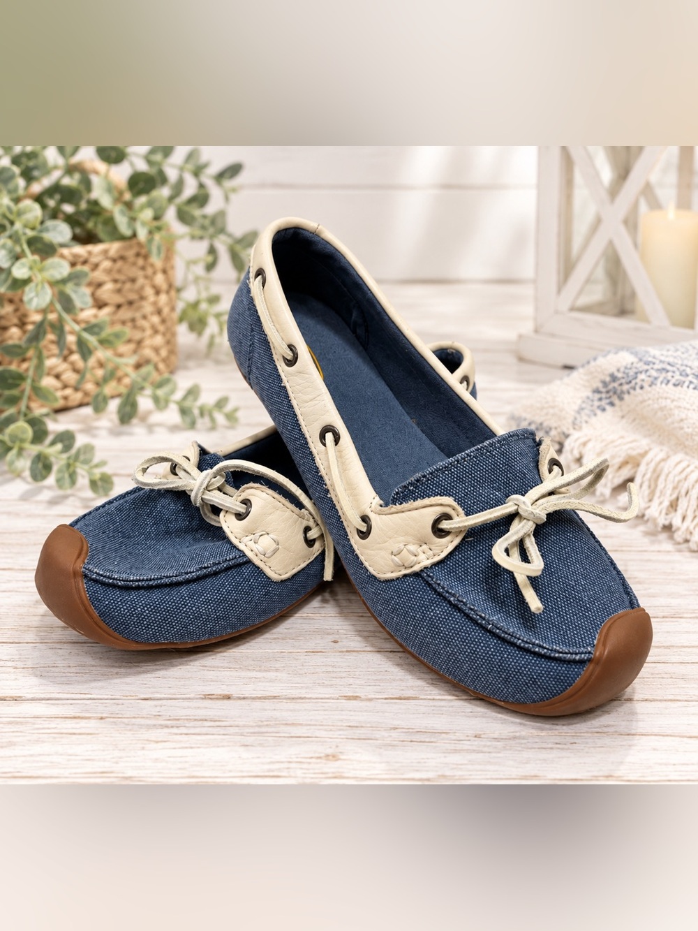 A pair of KEEN flats in a soft blue canvas with cream trim and little lace-up